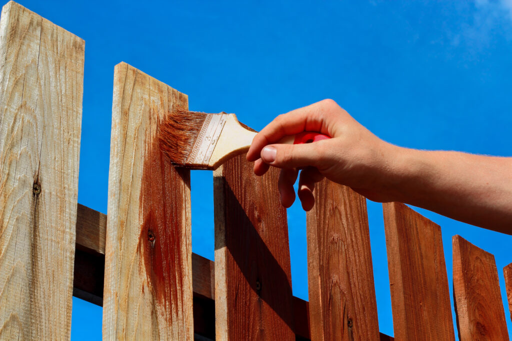 Should You Paint or Stain a Wood Fence